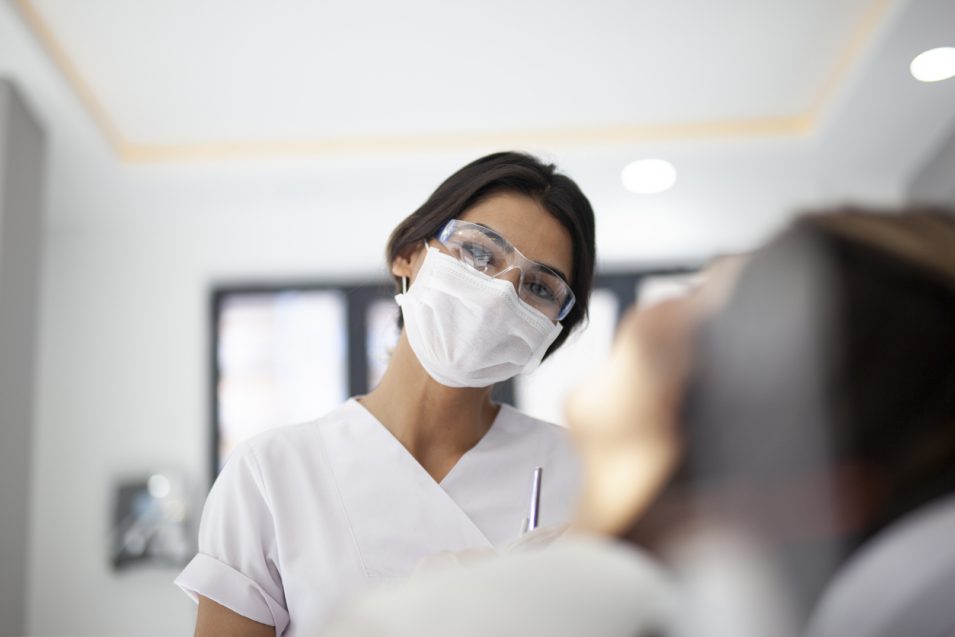 Dentist doing dental examination