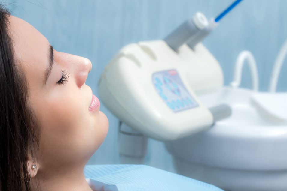 Side view of woman in dental clinic.
