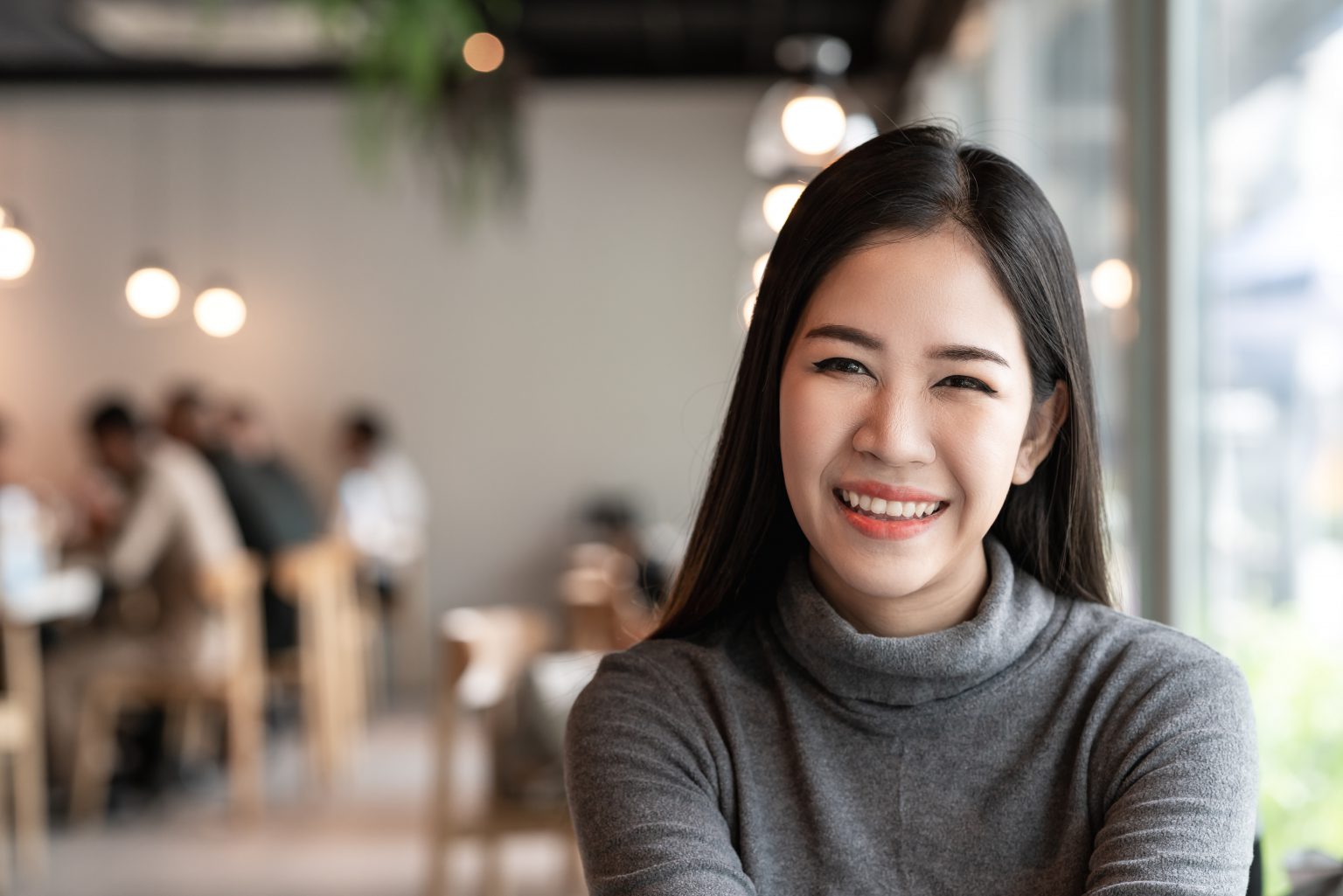 Patient smiling after getting dental bridges at Bayview Village Dental