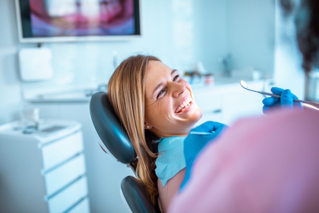 Lady patient getting dental check-up in North York