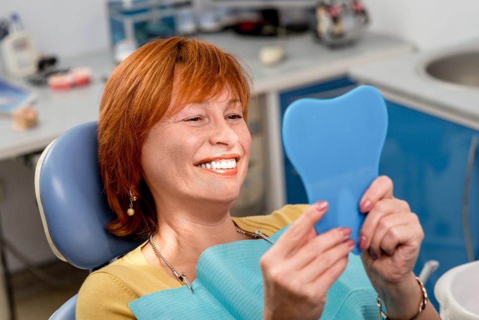 Lady paatient is happy after getting dental implants in North York