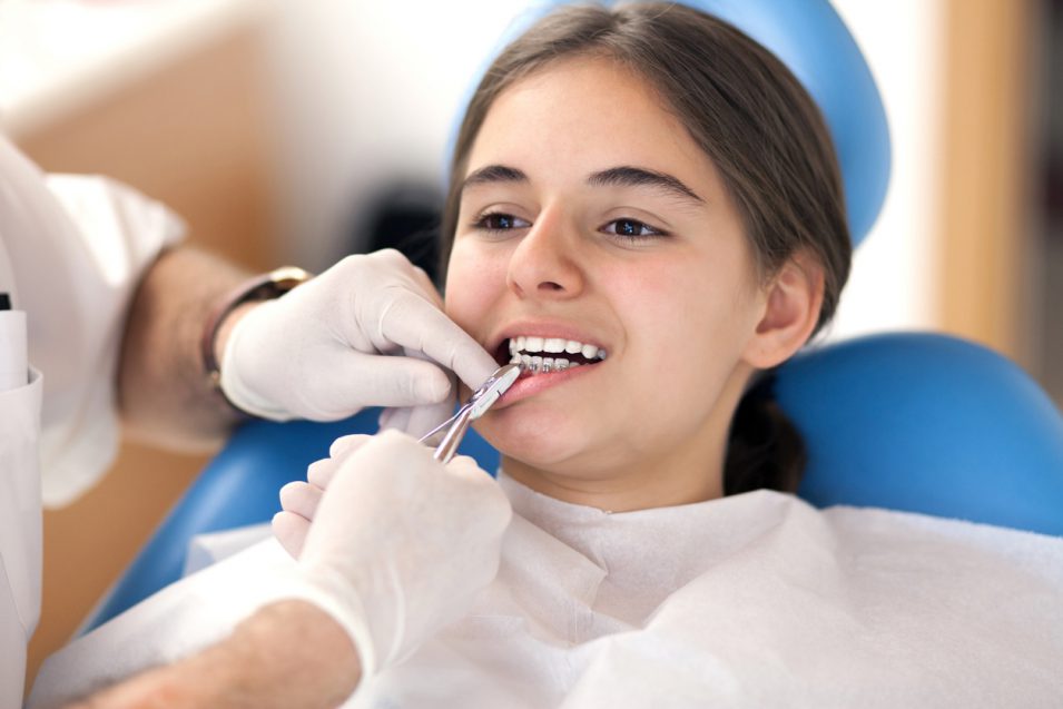 Little patient getting tooth extraction in North York