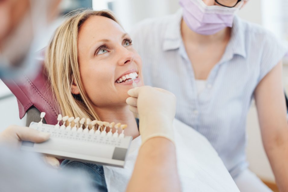 Dentist testing veneer in North York