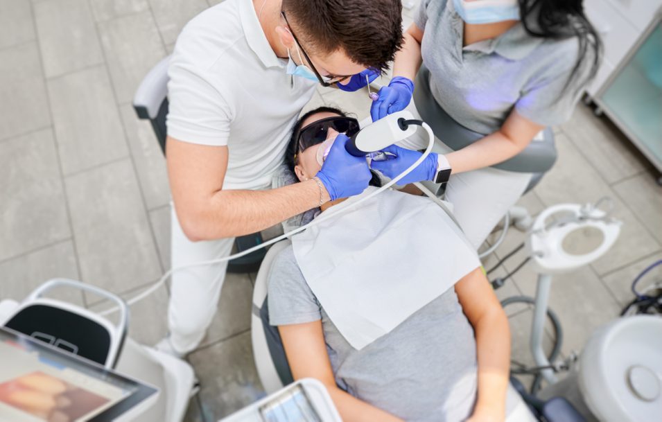 Patient treated with the help of advanced dental technology nearby