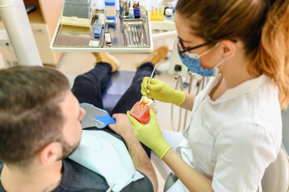 Endontist explaining dental condition of patient in North York