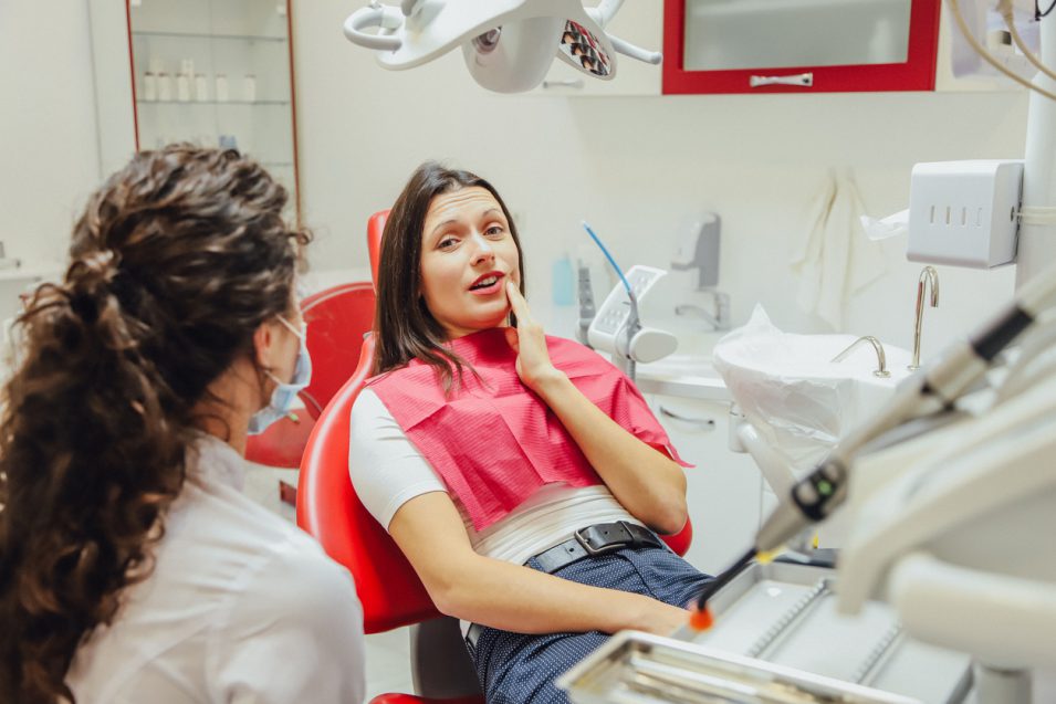 Patient going through oral and maxillofacial surgery in nearby dental clinic