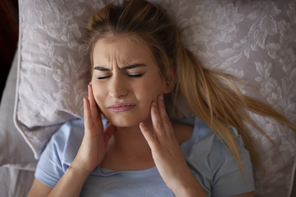 Women suffering from TMJ disorder needs treatment in North York