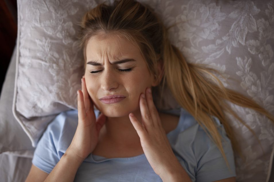 tmj treatment in north york Women suffering from TMJ disorder needs treatment in North York