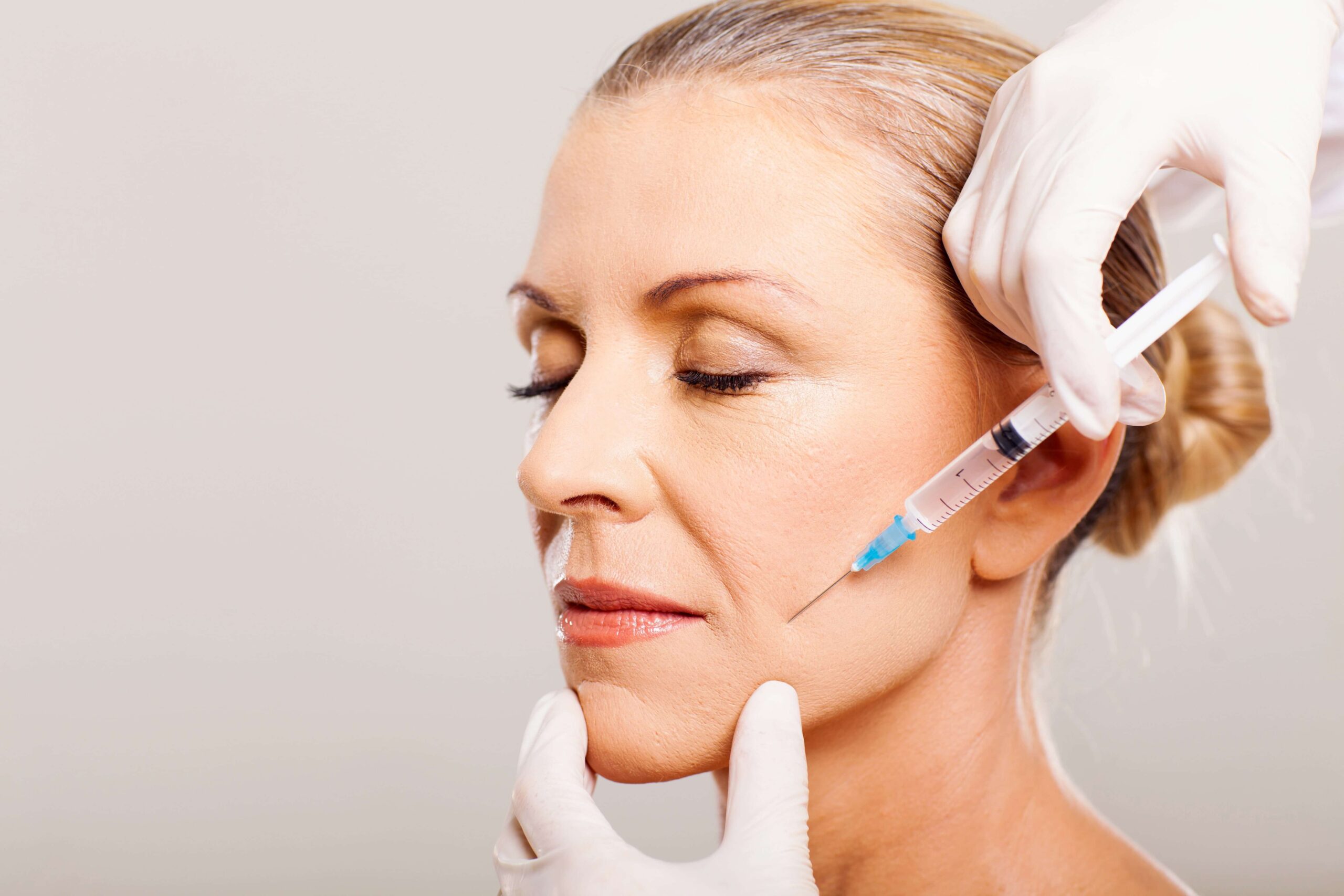 Lady getting botox for tmj treatment in North York