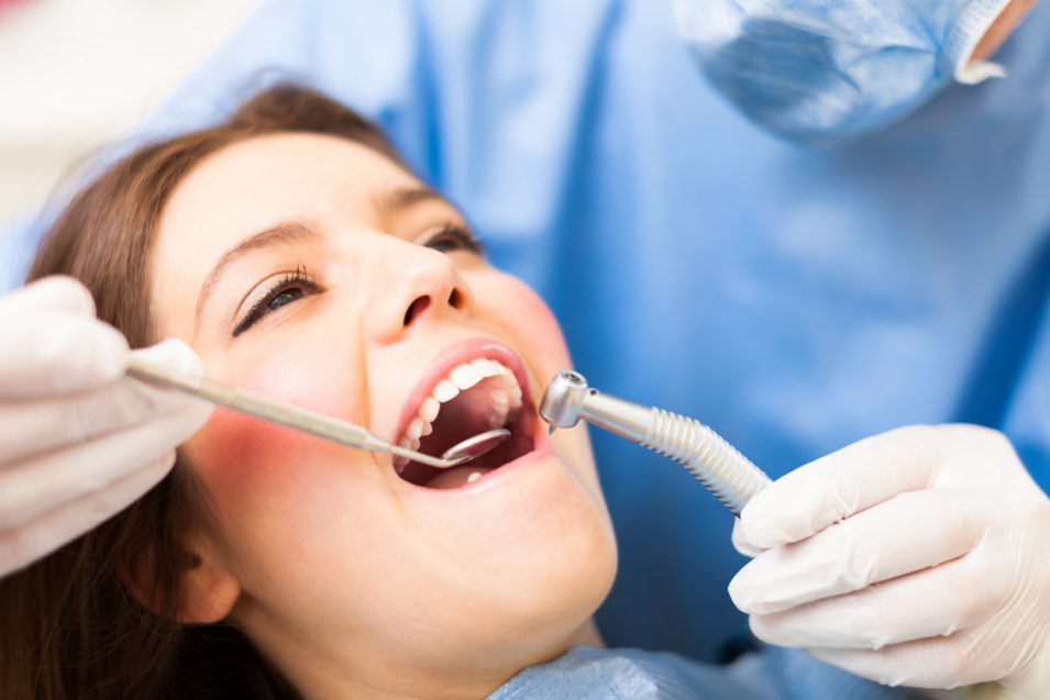 Patient going through dental filling in North York